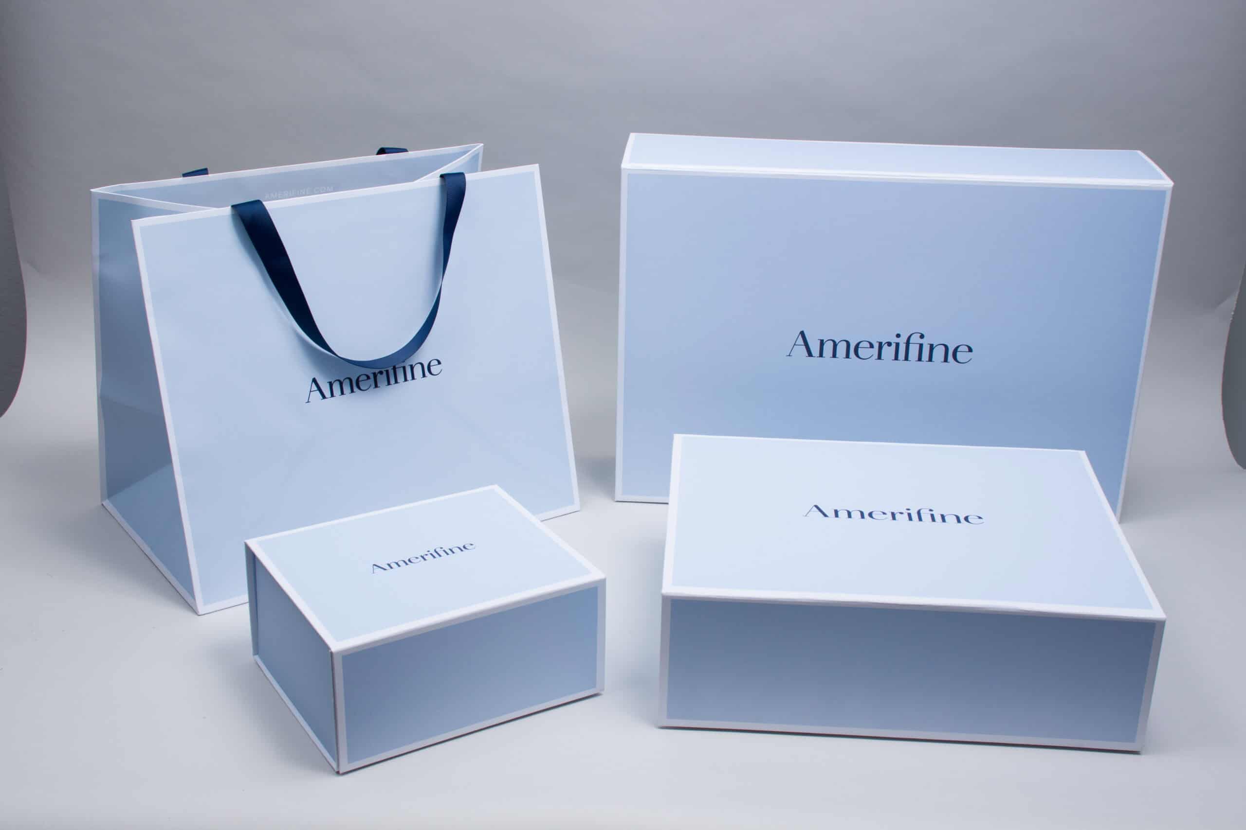 Coordinated branded packaging set with matching shopping bag and gift boxes