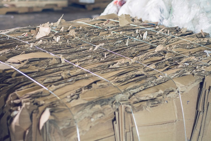 Baling wire securing cardboard bundles