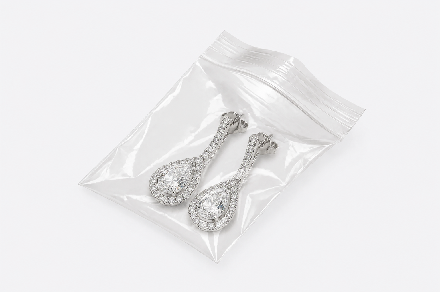 Pair of decorative earrings packaged in a small clear zip bag