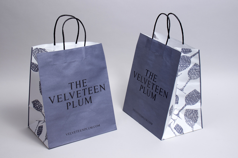 Custom paper shopping bag in plum brand colors